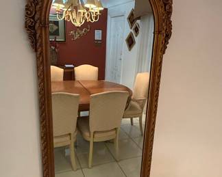 Ornate Gilt Wood Arch Top Mirror with Scrollwork and Floral Motifs
