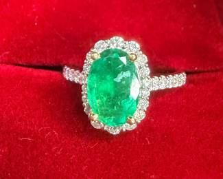 Large emerald diamond and platinum ring