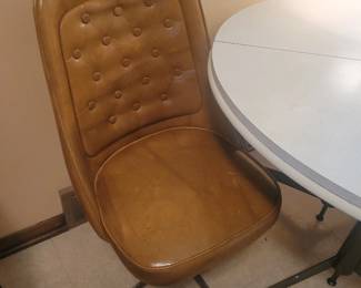 Table and rolling chairs