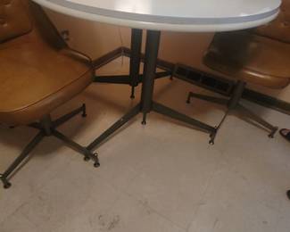 Table and rolling chairs