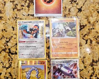 Five Pokemon cards sold as set