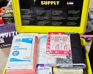 Outer Limit Supply yellow heavy-duty waterproof first aid kit case packed with medical supplies
