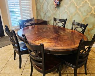 Hooker dining table with 7 (one not pictured) chairs. Structurally in good condition, top could use refinishing.. Priced accordingly