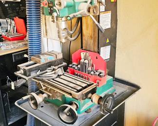 Grizzly Industrial benchtop mill/drill machine mounted on stand.