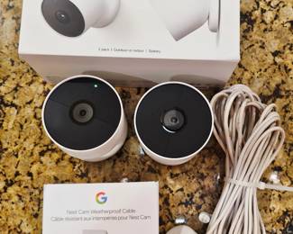 Google Nest security system setup two used cameras one used cable one new in the box cable two new in the box cameras sold as set