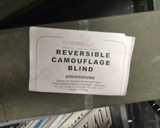 Reversible camouflage blind inside ammo can.