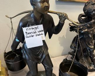 Bronze water carrier statue