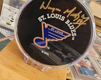Autographed Wayne Gretzky hockey puck.