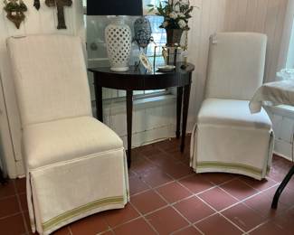 Custom covered Parsons chairs. Zoom in on the picture to view the detail on the bottom skirt.