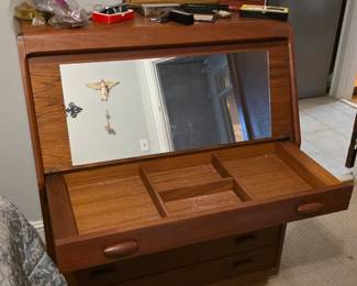 Dyrlund teak secretary desk features a tambour door that rolls up to reveal a work surface.