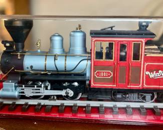 LGB Wild West Collectible G-scale Model Locomotive in Acrylic Display Case -. Known for its detailed craftsmanship and 0-4-4 chassis configuration, this model represents the classic 19th-century American pioneer era