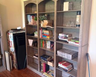 Gray washed bookshelves, books