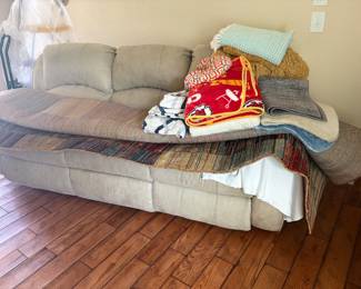 Upholstered, reclining sofa