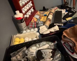 Golf Memorabilia Collection: Display Clock, Driver, and Assorted Golf Balls