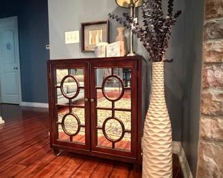 Mirrored Two-Door Accent Cabinet with Geometric Circle Overlay