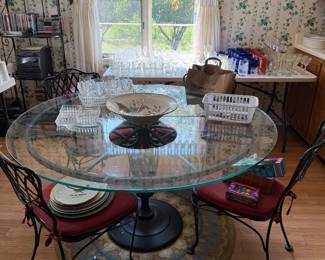 Table and 5 wrought iron chairs