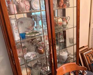 This gorgeous curio cabinet that lights up is a true treasure to keep your collections safe and dust freez
