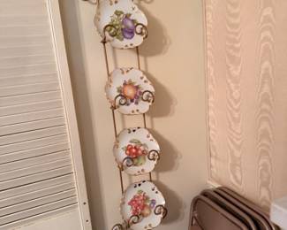 All one of a kind hand painted plates with lovely wall hanger