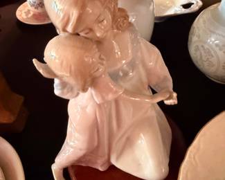 Adorable angel and toddler ceramic piece