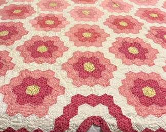 Vintage 1930s Two-Tone Pink "Grandmother’s Flower Garden" QuiltDescription: A visually striking Depression-era mosaic hexagon quilt featuring a coordinated concentric pink and white pattern with a tailored four-poster bedpost border notch. Hand-pieced and hand-quilted, originating from an Ohio/Pennsylvania family lineage.