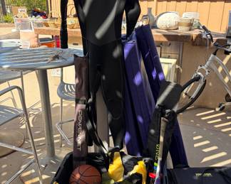 Assorted sports equipment, wetsuits, smashball, baseball, boxing gloves….etc
