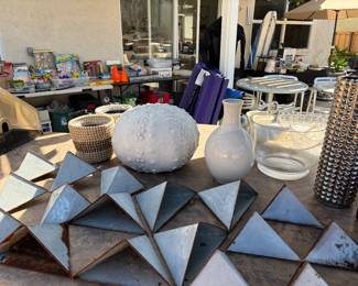 Assorted metal planters, pots, and vases