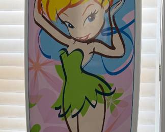 Disney Tinker Bell surfboard. Featuring a double sided Tinker Bell airbrush design with leash, and 3 FCS fins. 7’0 squash tail. Designed by Surftech founder, Randy French. Only 1 Tinker Bell surfboard was made per Disney store. This rare and highly collectible Disney surfboard has never been ridden. Excellent all original condition.