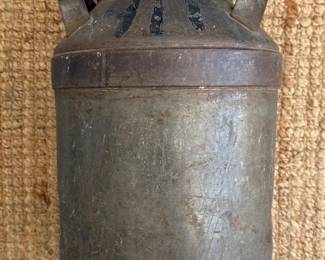 Antique metal milk jug