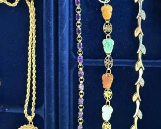 From Left 14 Kt. Gold coin and chain, 14 Karat gold with Amethyst, 14 KT. Jadeite and 14 Kt. white and yellow gold mixed gold.