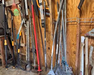 yard tools: rakes, axes, pick axes, fiskars clippers, loppers, hand saws