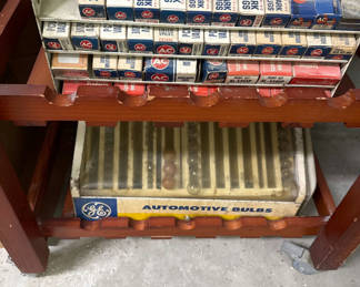 Lot 19: Vintage automotive parts and bulbs display