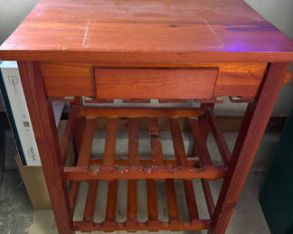 Lot 13: Wooden rolling cabinet with drawer and slatted shelves