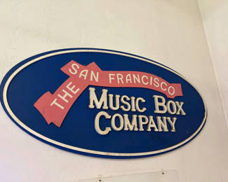 Lot 25: Oval San Francisco Music Box Company sign