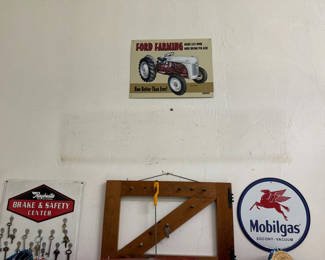 Lot 8: Vintage automotive signs, keys, and frame saw