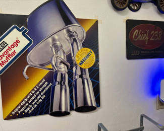 Lot 15: Vintage automotive signs and exhaust-pipe poster
