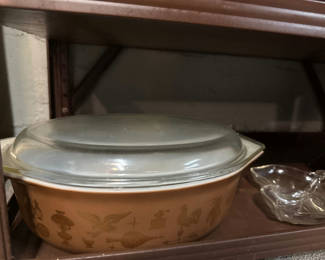 Lot 216: PYREX ceramic casserole with glass lid, brown ceramic bowl, and glass serving dish