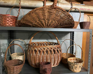 Lot 249: Assorted wicker baskets on a metal shelf