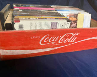 Lot 260: Red Coca-Cola crate with VHS tapes
