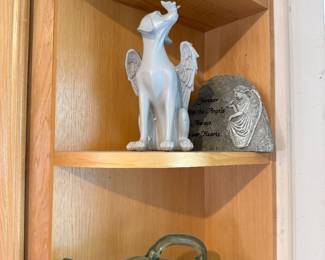 glass bottle and dog figure
