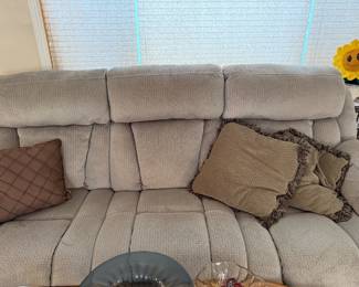 Reclining couch with throw pillows