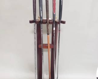 464 Lot 371 Golf club floor rack with golf clubs