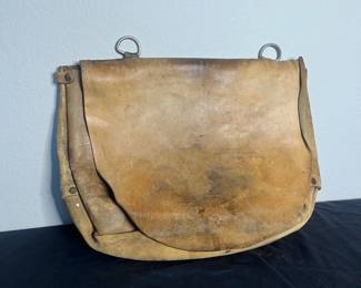 an Late 60s early 70s Leather Mail Saddlebag with Metal Rings and Sturdy Flap