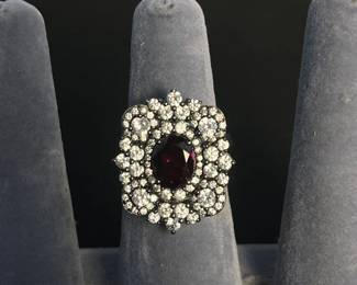 b Sterling Silver Ring with Deep Red Oval Stone and Halo of Clear Crystals