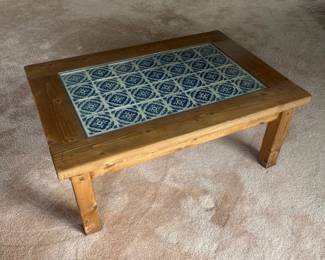 f Rustic Wooden Coffee Table with Decorative Blue and White Tile Inset