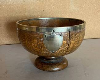 an Wooden Trophy Bowl with Metal Rim and Shield Emblem