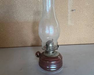 an Ceramic Base Kerosene Oil Lamp with Clear Glass Chimney