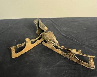 an Vintage BB Metal Ice Skates with Leather Straps