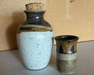 ar Handcrafted Ceramic Bottle with Cork Stopper and Accompanying Small Vase