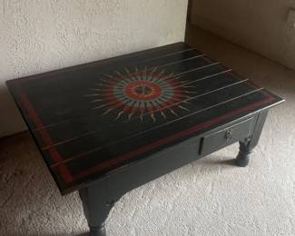 f Black Wooden Coffee Table with Sunburst Design and Storage Drawers