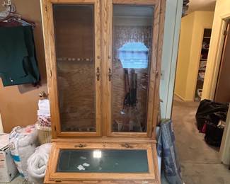 #057 Wood and glass gun cabinet with 3 doors and 2 drawers holds 10 guns 42x24x76 $125.00